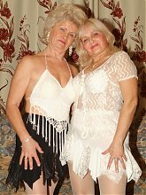 Francesca and Erlene are naughty grandmas in stockings spreading their pussies with dildos